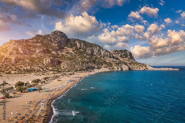 Fototapeta Tsampika beach with golden sand view from above, Rhodes, Greece. Aerial birds eye view of famous beach of Tsampika, Rhodes island, Dodecanese, Greece