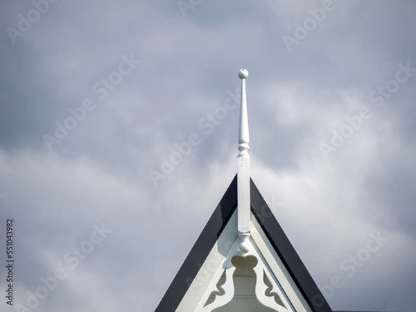 Fototapeta Gable roof with finial and carved fascia