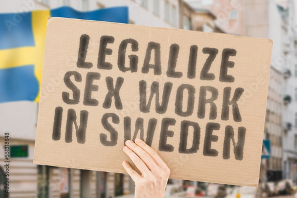 Fototapeta The phrase " Legalize Sex Work in Sweden " is on a banner in men's hands with blurred background. Guide. Govern. Body. Coworker. Crime. Criminal. Democracy. Desire. Employee. Earnings. Dollars