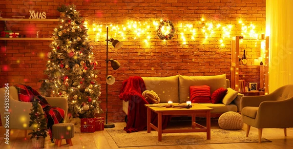 Fototapeta Interior of cozy living room with sofa, Christmas tree and glowing lights at night