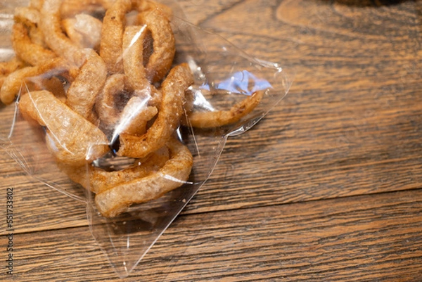 Fototapeta Pork Kappa ,in a plastic bag, is a food made from pork skin, fried and crispy. It is the food of Asian people.