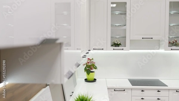 Fototapeta Modern white kitchen interior. White kitchen in the furniture showroom.