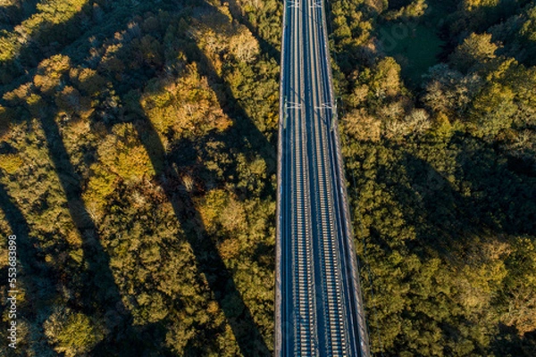 Fototapeta aerial view of a high speed train viaduct at dusk