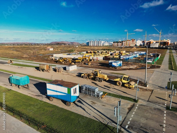 Fototapeta Heavy construction equipment for earthworks. Road renewal process, construction work. view from above. drone photography.