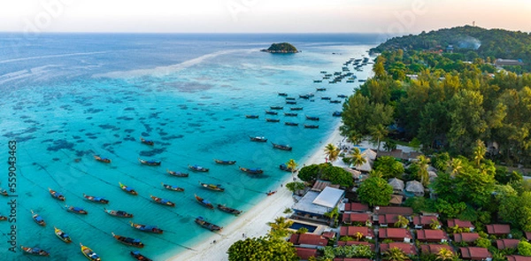 Fototapeta Aerial view of Sunrise beach with long tail boats in Koh Lipe, Satun, Thailand