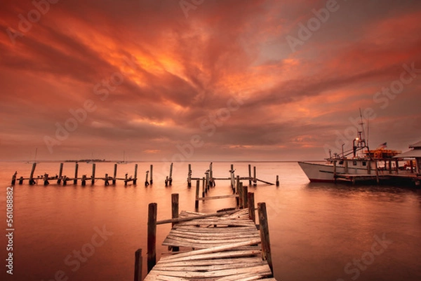 Fototapeta Shrimp boat at the dock in the intercostal waterway in Florida at sunset