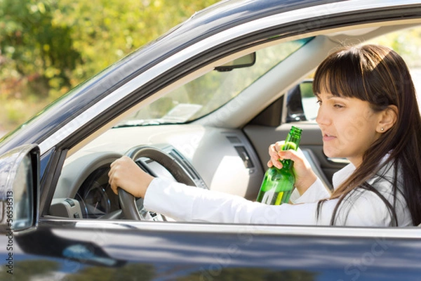 Fototapeta Happy inebriated female driver