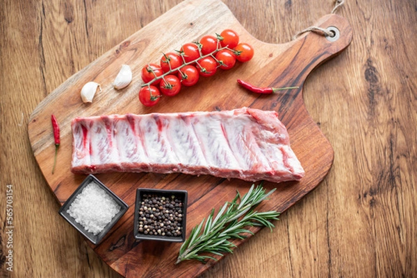 Fototapeta raw pork ribs on wooden background