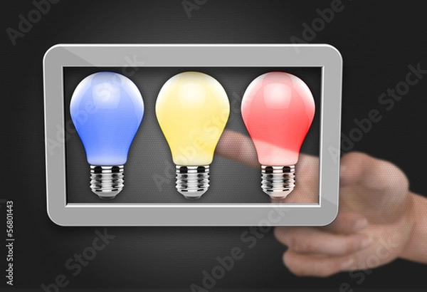 Fototapeta Light bulb in computer tablet