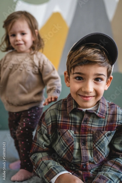 Fototapeta siblings portrait caucasian boy and girl brother and sister at home