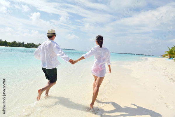 Obraz happy young couple have fun on beach