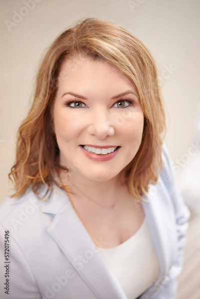 Fototapeta THE WOODLANDS, TEXAS - FEBRUARY 2023: a dental surgeon is posing for environmental business portraits in her practice. She specializes in Laser Dentistry, DURAthin, Lumineer veneers, dental implants.