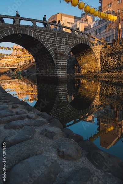 Fototapeta Meganebashi Bridge or Spectacle Bridge in sunset with lantern festival.