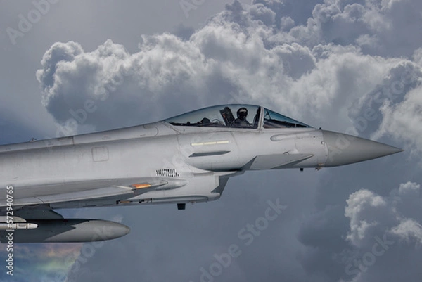 Fototapeta RAF Typhoon Fighter Jet in Flight. Action photograph of Fast Jet military aeroplane on a combat mission. Used against Houthi Rebels