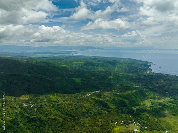 Fototapeta Aerial drone of mountains and hills with green forest and clouds. Negros, Philippines