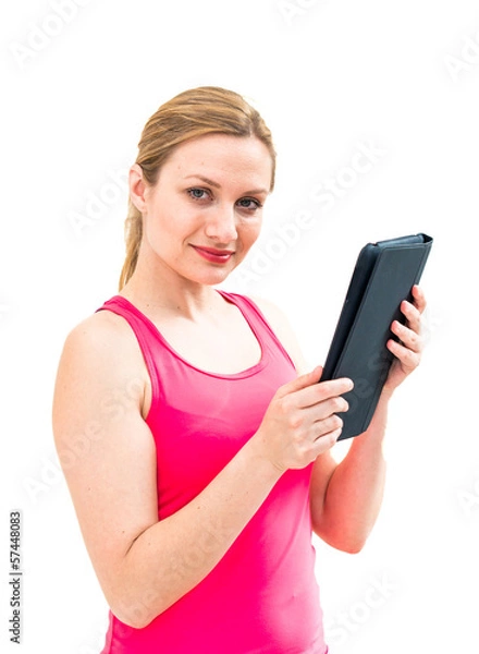 Fototapeta young woman holding in hand a tablet touch pad