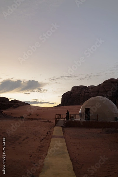 Fototapeta sunset in the desert with tent