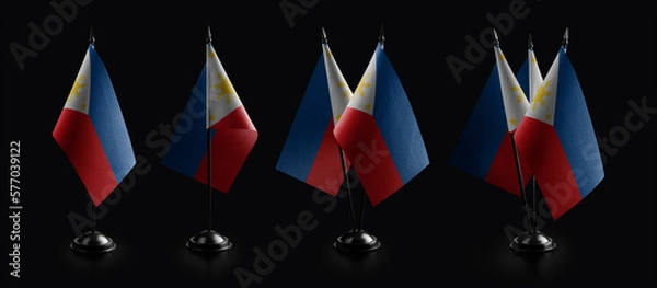 Fototapeta Small national flags of the Philippines on a black background