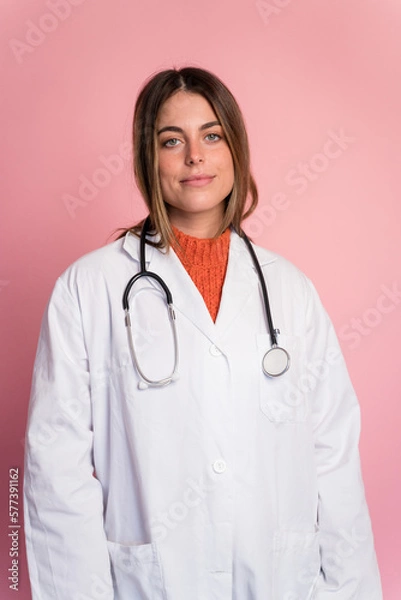 Fototapeta Doctor with stethoscope on pink background