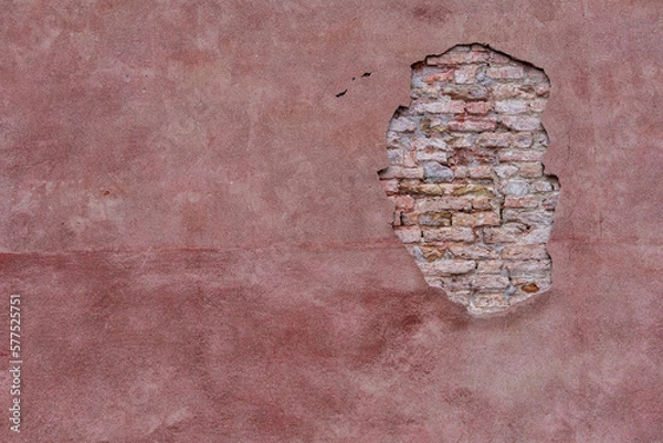 Obraz Opening on a wall of a house in Venice. You can see the bricks and the details of the wall. Pink and highly detailed texture.