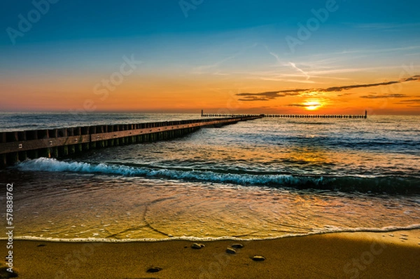 Fototapeta sunset over the sea, beach, sea, wooden breakwater, colorful background, wallpaper for projects, holiday landscape