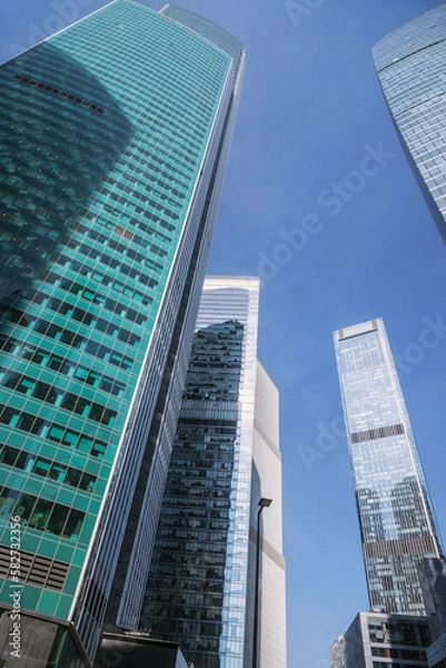 Fototapeta Upward view of modern skyscrapers in business center of Moscow City. Moscow. Russia