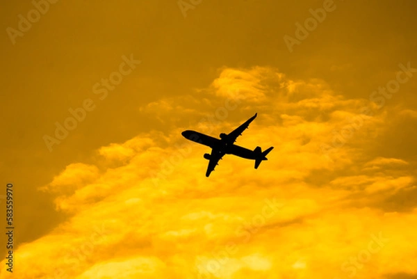 Fototapeta Aircraft Passenger take off  shot at sunset time