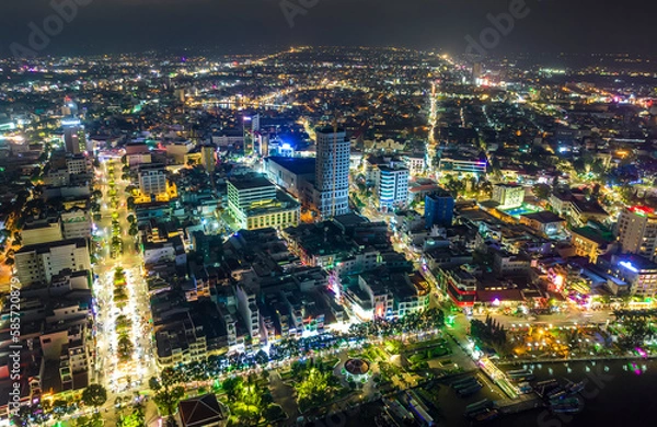 Fototapeta Can Tho city, Can Tho, Vietnam at night, aerial view. This is a large city in Mekong Delta, developing infrastructure, population, and agricultural product trading center of Vietnam