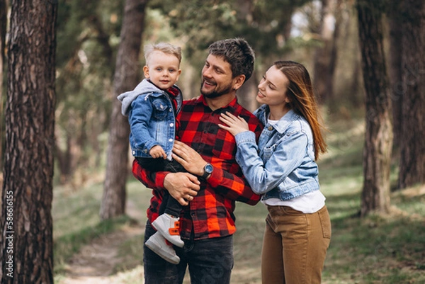 Fototapeta Family with little son together in the forest