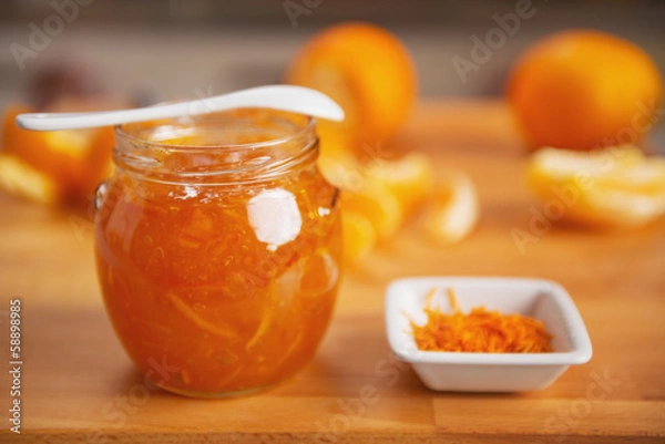 Fototapeta Closeup on jar with orange jam