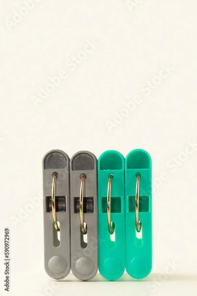 Fototapeta Green and gray plastic clothes pegs.