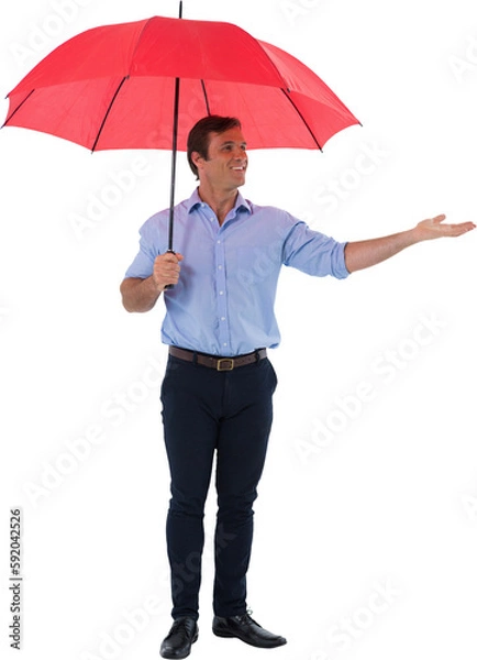 Fototapeta Male executive holding red umbrella