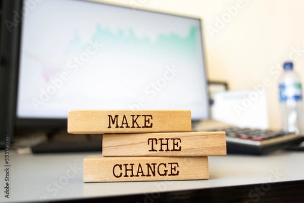 Fototapeta Wooden blocks with words 'Make the change'. Business concept