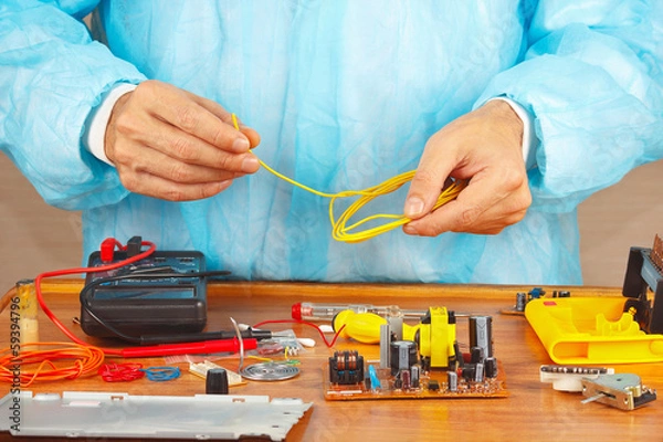 Fototapeta Master repairing electronic hardware in the service workshop