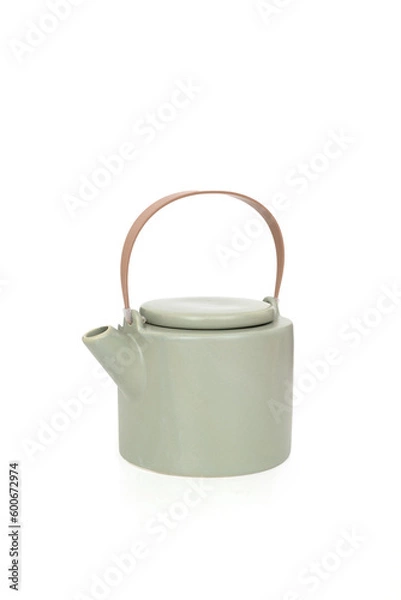 Fototapeta Porcelain light green teapot with a handle isolated on white 