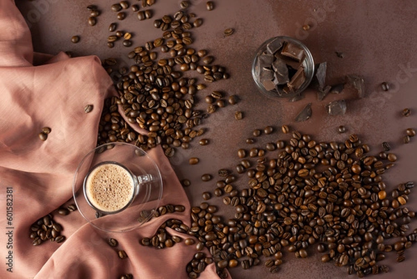 Fototapeta Turkish coffee in a modern glass cup. Concept scene presentation with coffee beans and same tone colors.