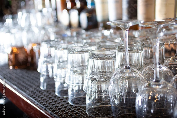 Obraz A view of a counter full of clean cocktail glasses.