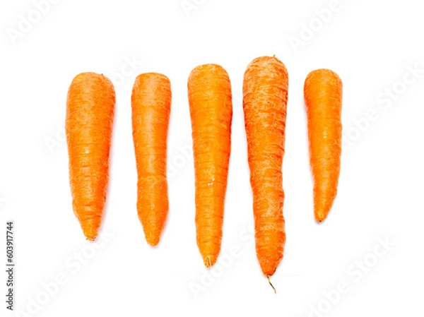 Fototapeta ripe washed carrots on a white background