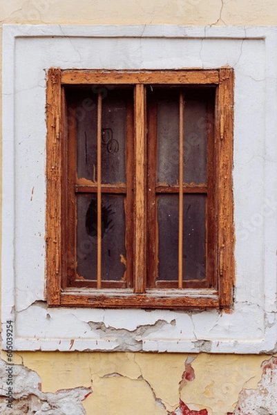 Fototapeta Old cracked wall with a window. window of old house. Old window with brown frame.