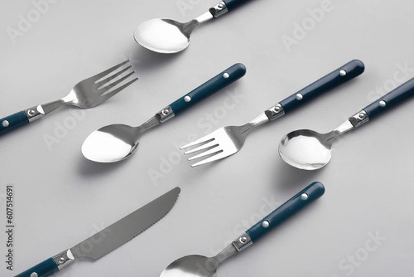 Fototapeta Stylish cutlery on grey background