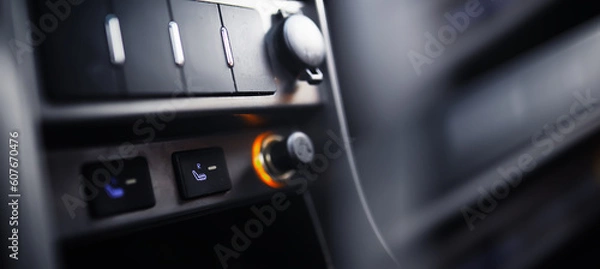 Fototapeta The process of choosing climate control in the car. Various controls in auto switches. Modern car interior