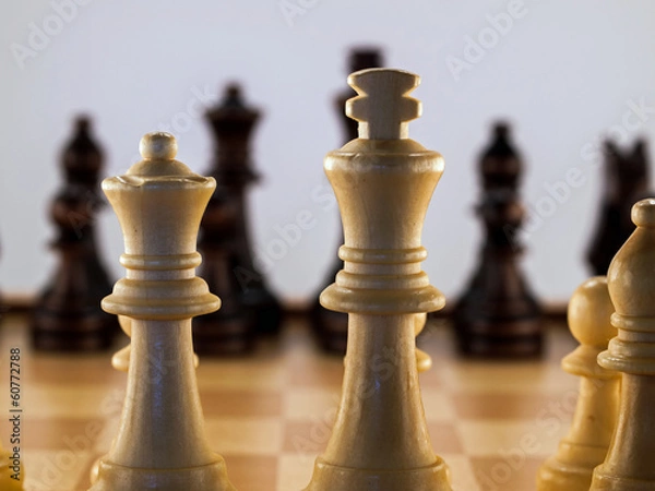 Fototapeta Wooden Chess Pieces on a Wooden Chessboard