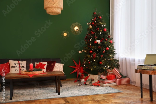 Fototapeta Cozy living room with Christmas tree and festive decor. Interior design