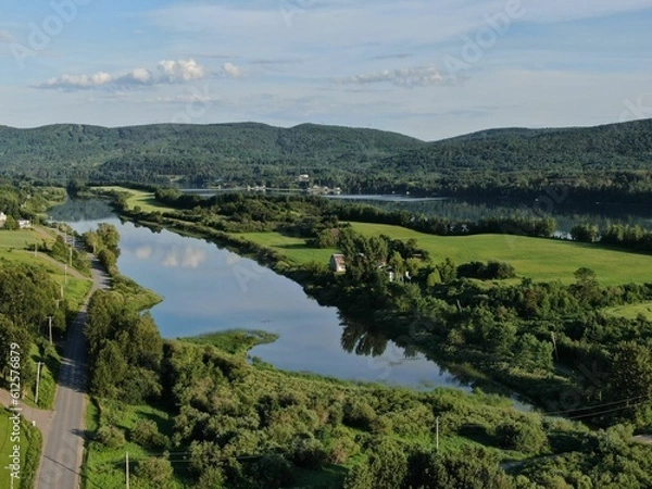 Fototapeta View of the peninsula at Hebertville and the Laurentian mountain in the Saguenay