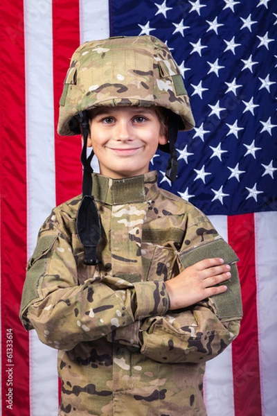 Fototapeta Young boy dressed like a soldier with American flag