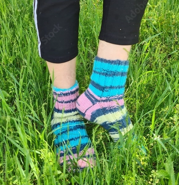 Fototapeta A person's feet in grass