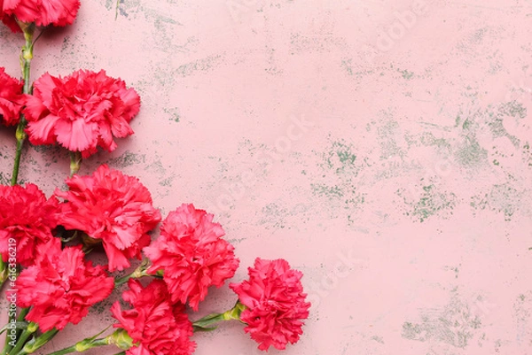 Fototapeta Red carnations on pink grunge background