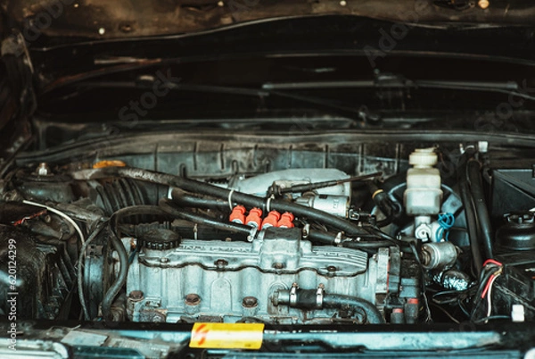 Fototapeta View of the car under the hood. Close-up view of the car. Injector and engine pistons. Car repair