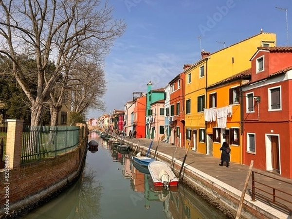 Fototapeta Colourful houses across water canal