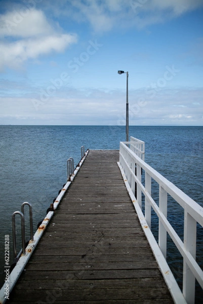 Fototapeta An old pier by the bay in Victoria, Australia.